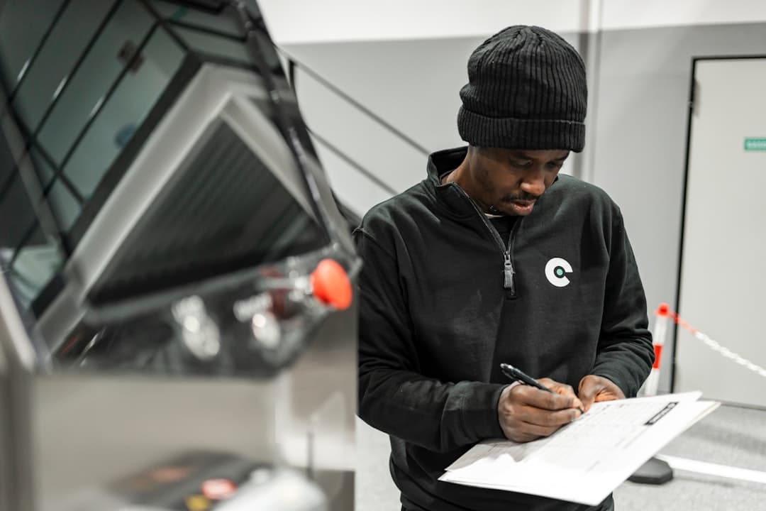 A technician inspecting a control panel.